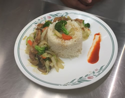 plate of rice with sauteed vegetables 
